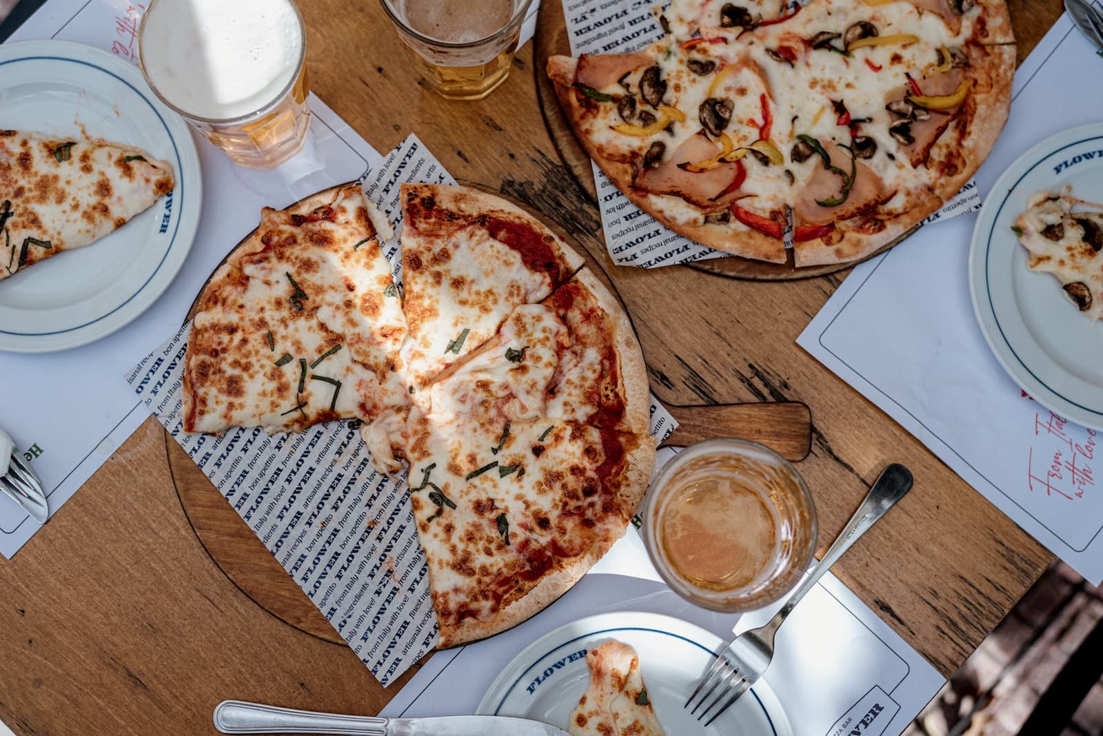 Flower pizzas on a wooden table