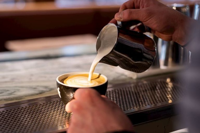Coffee being poured into a cup